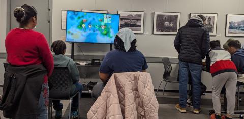 Several young people playing videogames