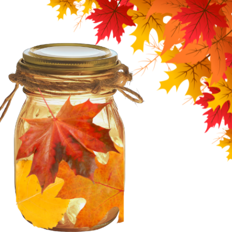a decorative corner of autumn leaves, plus some string lights in a jar, the jar being covered with decoupaged autumn leaves