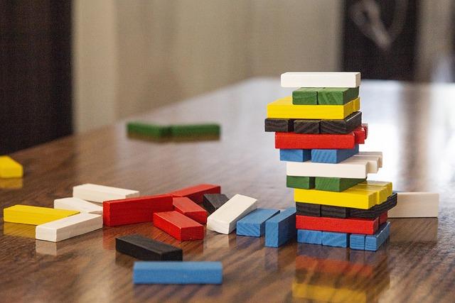 A multicolored JENGA (wooden unstacking game) set