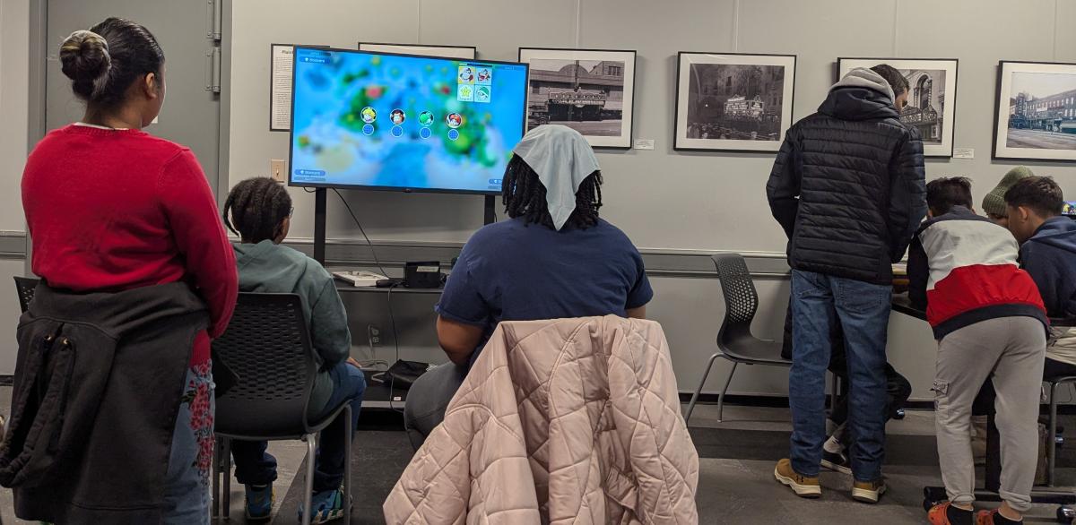 Several young people playing videogames